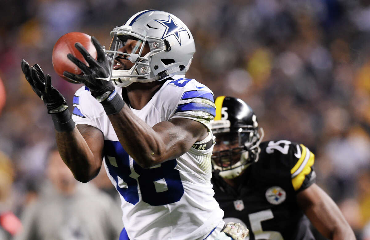FILE- In this Nov. 13, 2016, file photo, Dallas Cowboys wide receiver Dez Bryant (88) hauls in a touchdown pass during the second half of an NFL football game with Pittsburgh Steelers cornerback Artie Burns (25) defending in Pittsburgh. Bryant is the oldest Dallas receiver and among the top five in tenure with the Cowboys. (AP Photo/Fred Vuich, File)