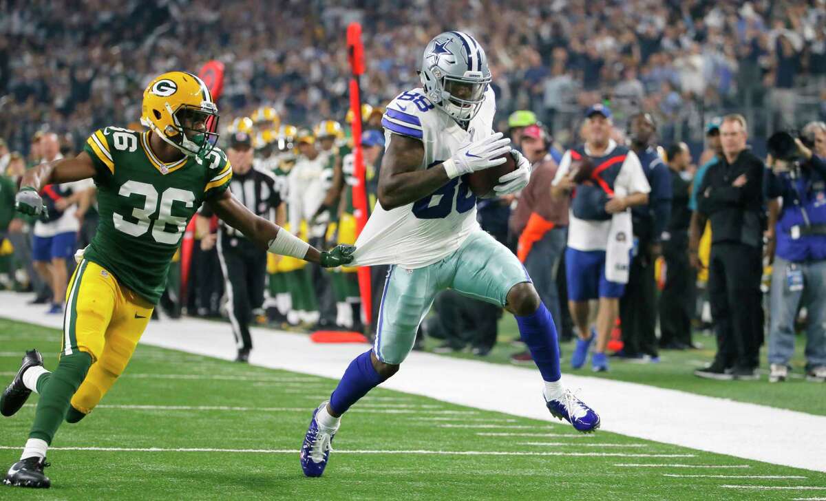 FILE- In this Jan. 15, 2017, file photo, Dallas Cowboys wide receiver Dez Bryant (88) breaks away from Green Bay Packers cornerback LaDarius Gunter (36) defends to score a touchdown during the first half of an NFL divisional playoff football game in Arlington, Texas. Bryant is the oldest Dallas receiver and among the top five in tenure with the Cowboys. (AP Photo/Tony Gutierrez, File)