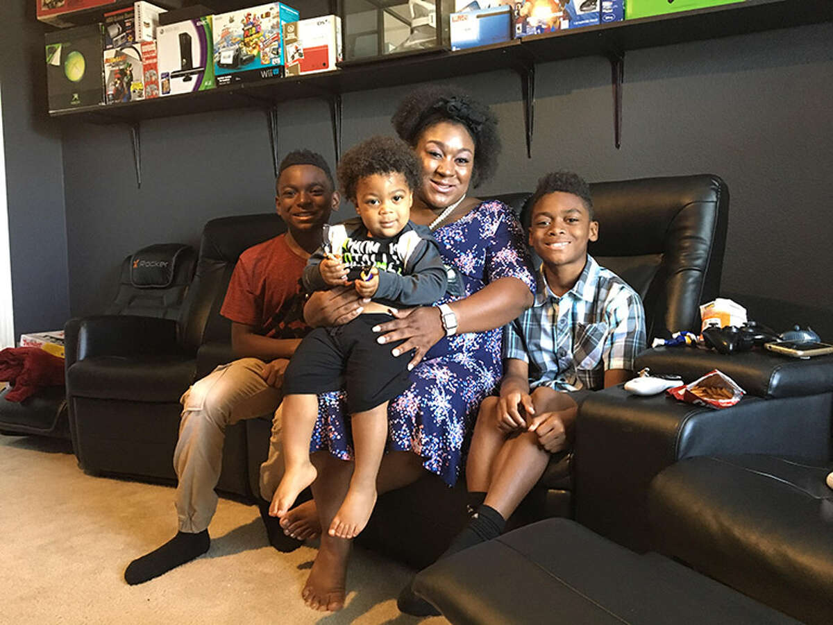 Jessica Chester, with her﻿ three children,﻿ Ivory, left, Kameron and Skylar, ﻿﻿ got a degree and works for a Dallas hospital doing community outreach and family planning.