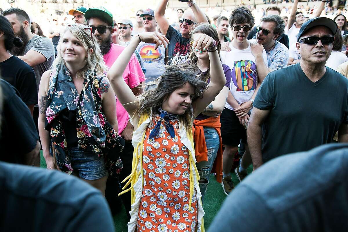 A festival goer dances as Eric Burdon and The Animals perform at the Monterey International Pop Festival at the Monterey County Fairgrounds in Monterey, Calif. Friday, June 16, 2017.