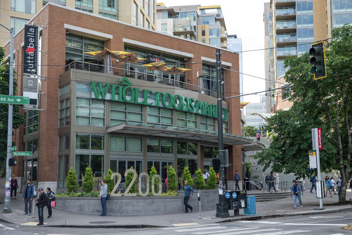 Whole Foods Market in Denny Triangle, near Amazon headquarters in Seattle photographed on Friday, June 16, 2017. Amazon announced its planned purchase of the grocery chain in a deal valued at $13.7 billion. (Grant Hindsley /seattlepi.com via AP)