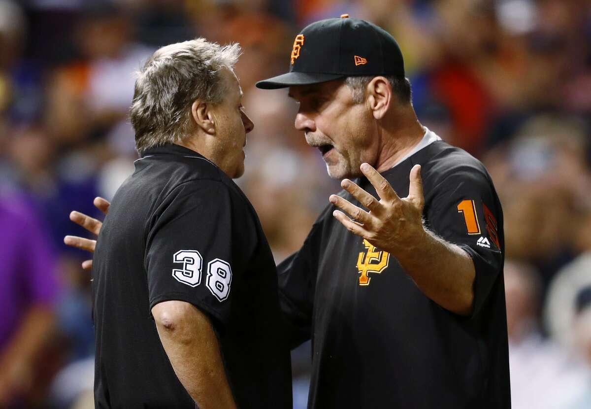 San Francisco Giants manager Bruce Bochy, right, argues with home plate umpire Gary Cederstrom after he ejected Bochy during the seventh inning of the Giants' baseball game against the Colorado Rockies on Friday, June 16, 2017, in Denver. The Rockies won 10-8. (AP Photo/David Zalubowski)