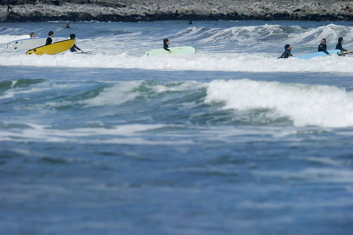 Surfers conquer Pacifica waves on International Surfing Day