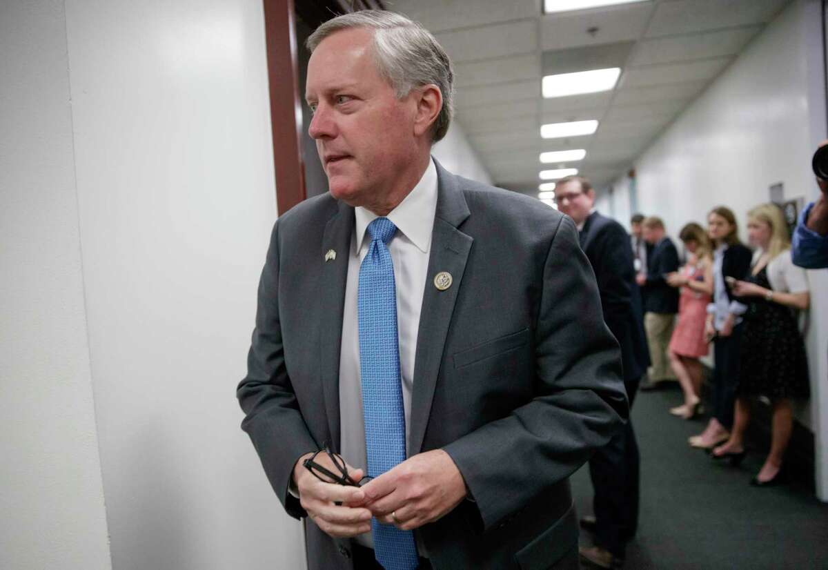 FILE - In this March 28, 2017, file photo, House Freedom Caucus Chairman Rep. Mark Meadows, R-N.C walks on Capitol Hill in Washington. A key part of House RepublicansÂ?’ plan to overhaul the way corporations pay taxes is on life support, leaving lawmakers scrambling to save one of President Donald TrumpÂ?’s biggest priorities and increasing the chances the GOP will simply pass a tax cut instead of overhauling the tax code. (AP Photo/J. Scott Applewhite, File)