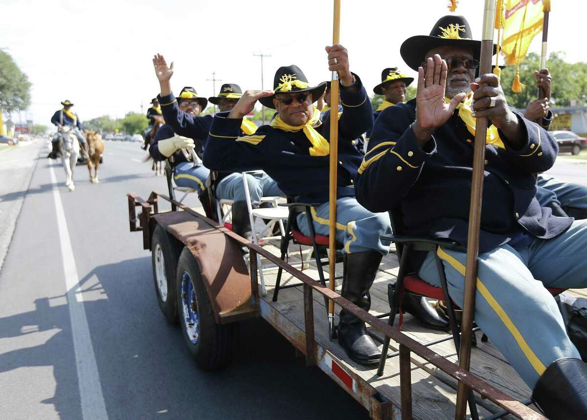 Bexar County Buffalo Soldiers Association's Ken Vaughn (right), Pat Patterson (saluting) and other members join in celebrating Juneteenth with a parade from Sam Houston High School to Comanche Park in June 2017. This year’s parade starts at 8:30 a.m. Saturday, June 15, and follows the same route, from Sam Houston HS at 4635 E. Houston St., to Comanche Park No. 2, 2600 Rigsby Ave.