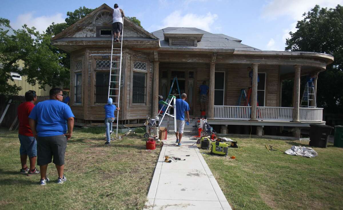 Haven for Hope volunteers help renovate the home of Miguel Calzada on West French Place. The home was slated for demolition by the city before Calzada’s neighbors and friends rallied to save the structure. It has been designated a local historic landmark.