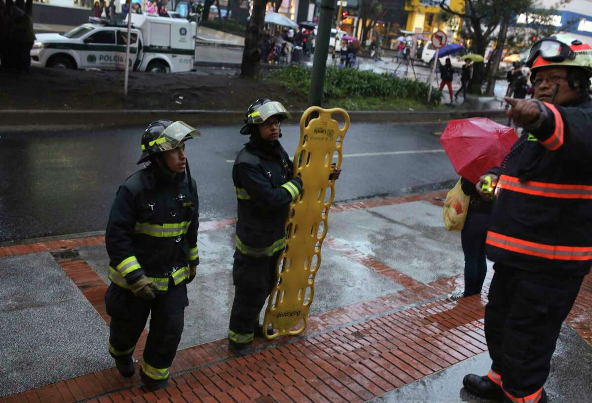 Firefighters arrive at the Centro Andino shopping center in Bogota, Colombia, Saturday, June 17, 2017. A explosion rocked the mall, one of the busiest in Colombia's capital, killing at least one woman and injuring 11 others. (AP Photo/Ricardo Mazalan)