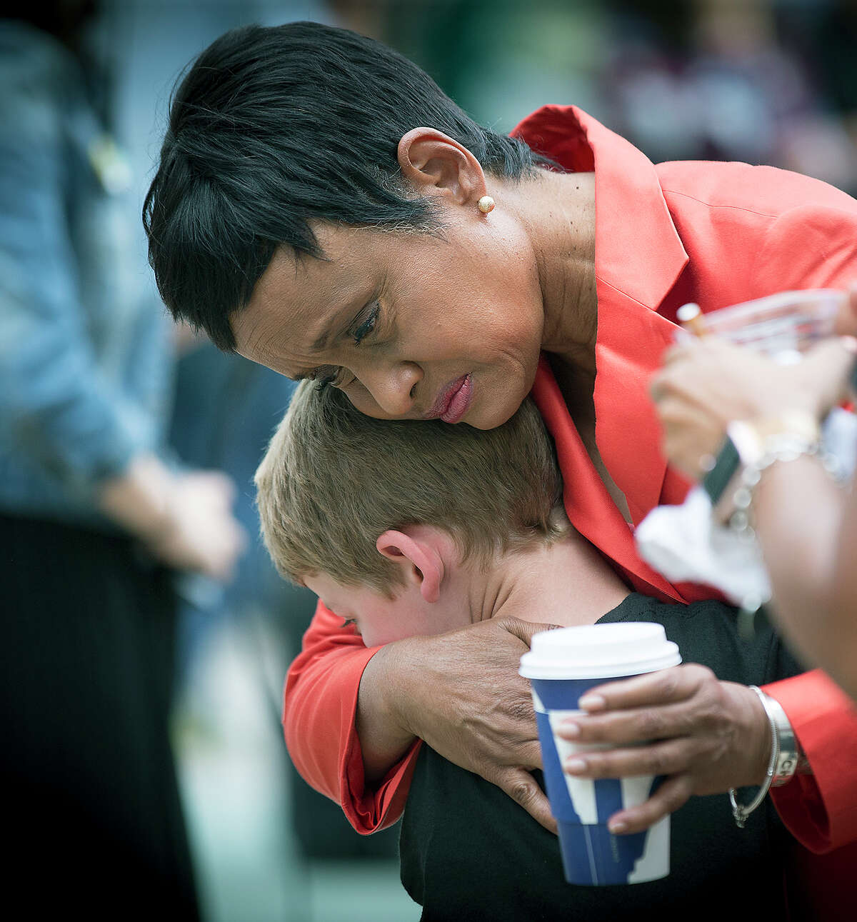 Judge Glenda Hatchett was hugged by Philando Castile supporter Guthrie Morgan, 7, after Jeronimo Yanez was found not guilty on all counts in the shooting death of Philando Castile, Friday, June 16, 2017 in St. Paul, Minn. (Elizabeth Flores/Star Tribune via AP) ORG XMIT: MNMIT113