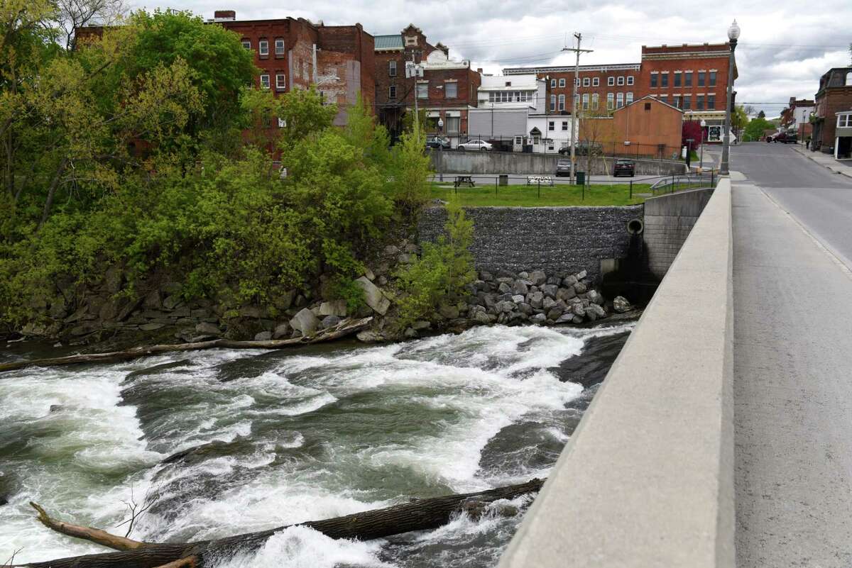 The Hoosic River flows under Church Street on Wednesday, May, 10, 2017, in Hoosick Falls, N.Y. (Will Waldron/Times Union)