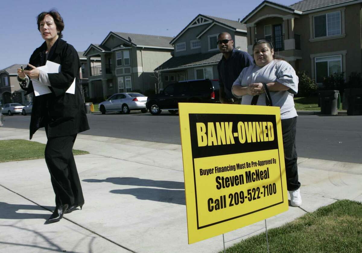 A real estate agent walks into a bank owned home she is showing to clients in Stockton, Calif. A report published Friday by Harvard University’s Joint Center For Housing Studies found that the number of Americans spending 50 percent of their income on rent is near historic highs.