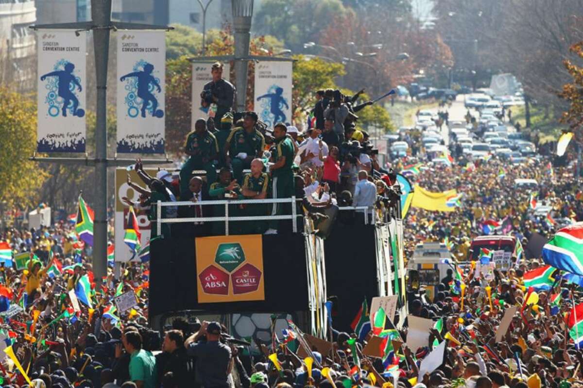 SANDTON, SOUTH AFRICA - JUNE 09: The South Africa team parade through the district of Sandton as thousands of local supporters cheer on June 9, 2010 in Sandton, South Africa. (Photo by Michael Steele/Getty Images)