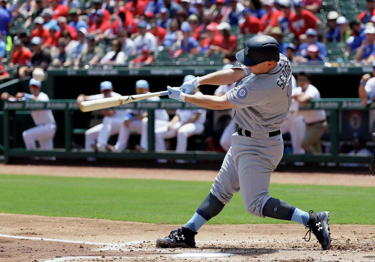 Seattle Mariners' Kyle Seager follows through on a run-scoring double off a pitch from Texas Rangers' Yu Darvish during the first inning of a baseball game, Sunday, June 18, 2017, in Arlington, Texas. (AP Photo/Tony Gutierrez)