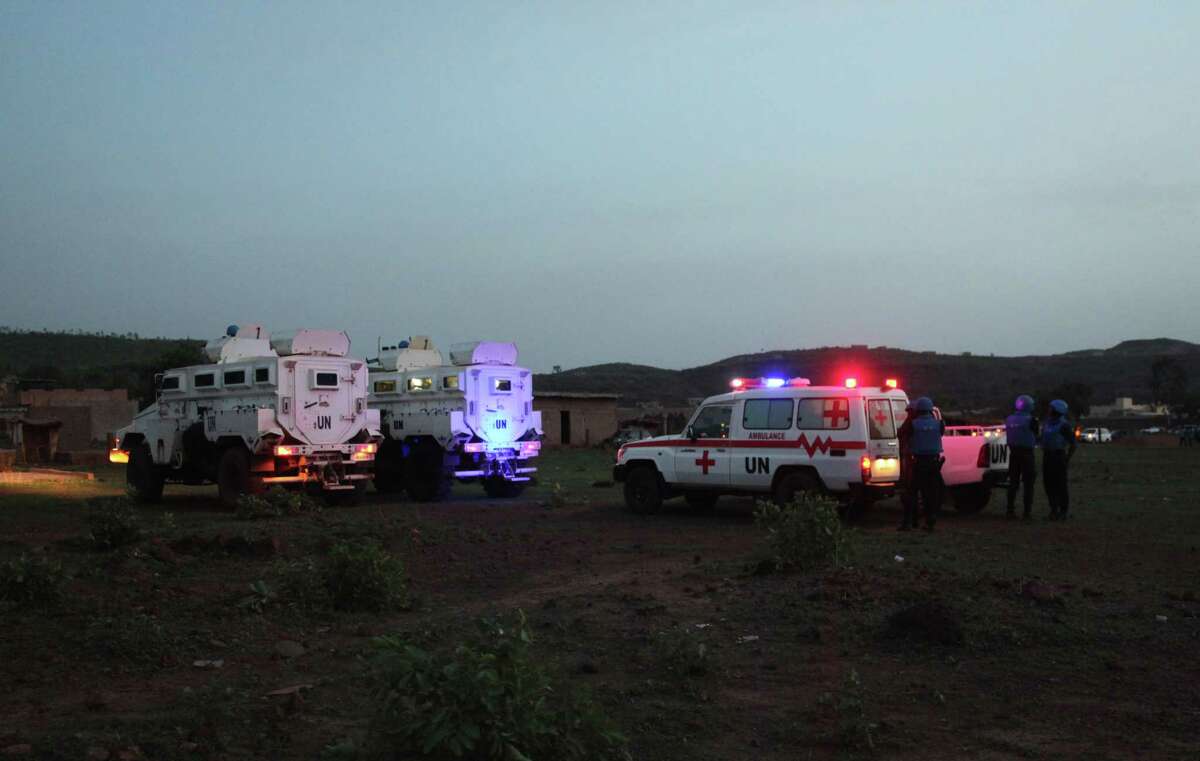 United Nations armored personnel vehicles are stationed with an ambulance outside Campement Kangaba, a tourist resort near Bamako, Mali, Sunday, June 18, 2017. A security official says suspected jihadists have attacked the resort in Mali's capital that is popular with foreigners on the weekends. The official with the U.N. mission known as MINUSMA, said people had been killed and wounded but gave no immediate toll. There also were believed to be hostages inside the luxury resort area. The people inside the Campement Kangaba hotel come from multiple nationalities, he added. (AP Photo/Baba Ahmed)