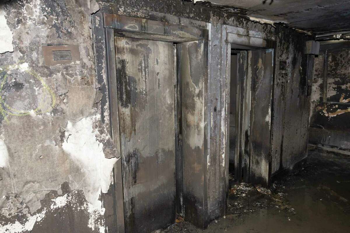 In this photo released by the Metropolitan Police on Sunday, June 18, 2017, burnt out lifts on an undisclosed floor, in the Grenfell Tower after fire engulfed the 24-storey building, in London. ??Experts believe the exterior cladding, which contained insulation, helped spread the flames quickly up the outside of the public housing tower early Wednesday morning. Some said they had never seen a building fire advance so quickly. The 24-story tower that once housed up to 600 people in 120 apartments is now a charred ruin. (Metropolitan Police via AP)