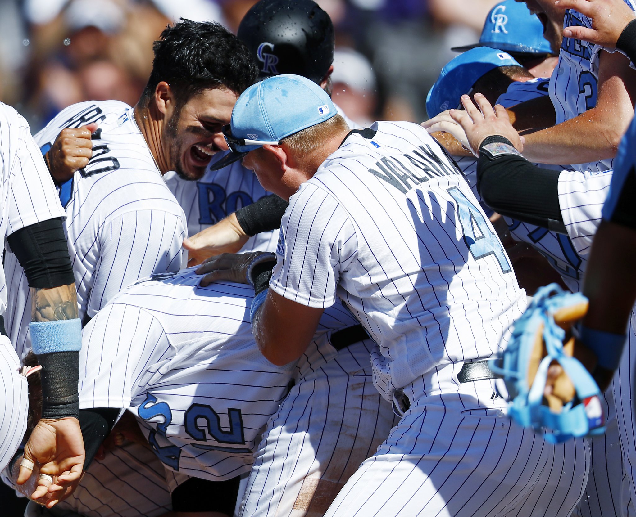 Colorado Rockies' Pat Valaika heads back to the dugout after being