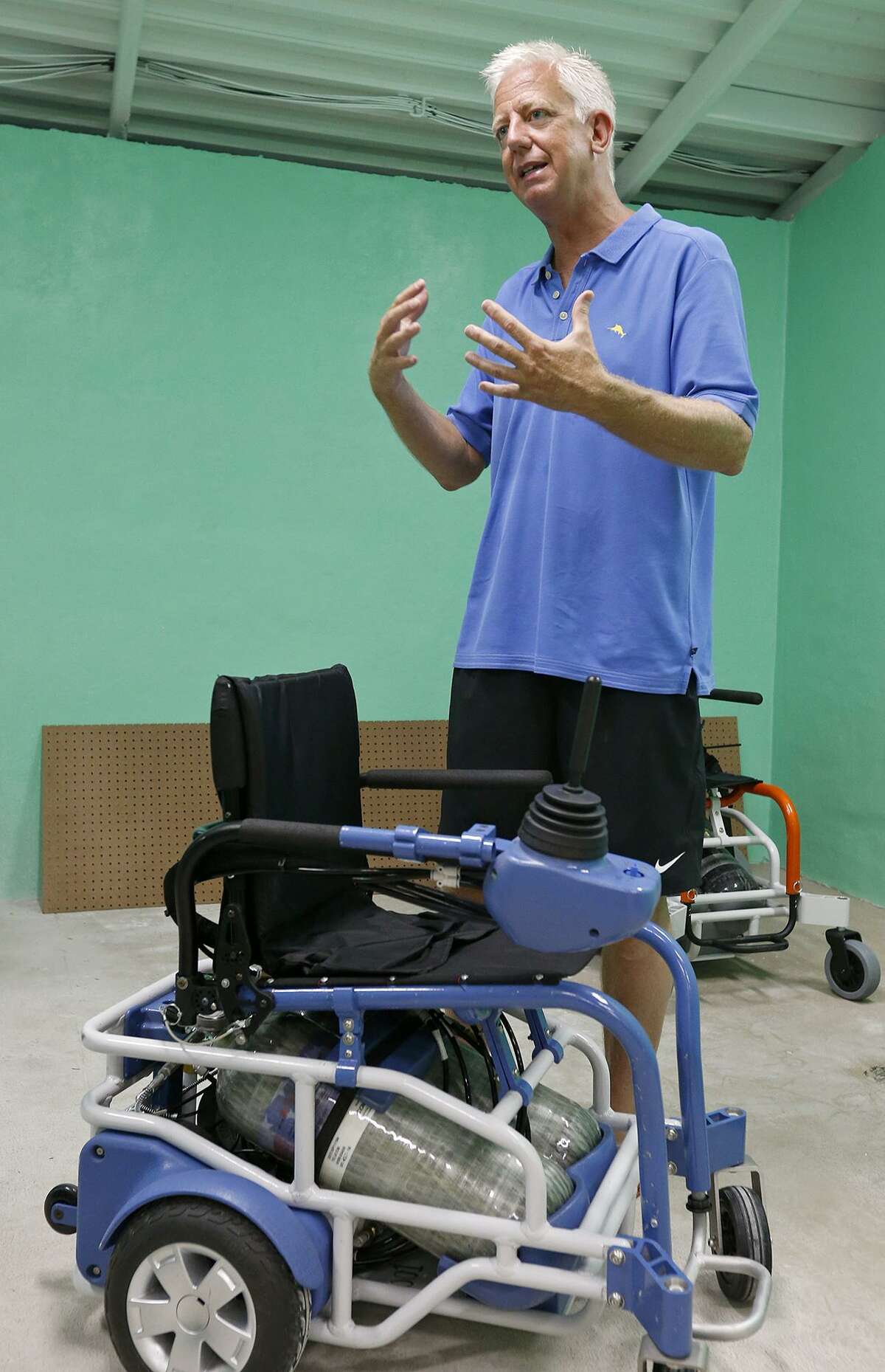 Morgan's Wonderland founder Gordon Hartman shows pneumatic wheelchairs used at Morgan?•s Inspiration Island Sunday June 18, 2017 at the splash park.