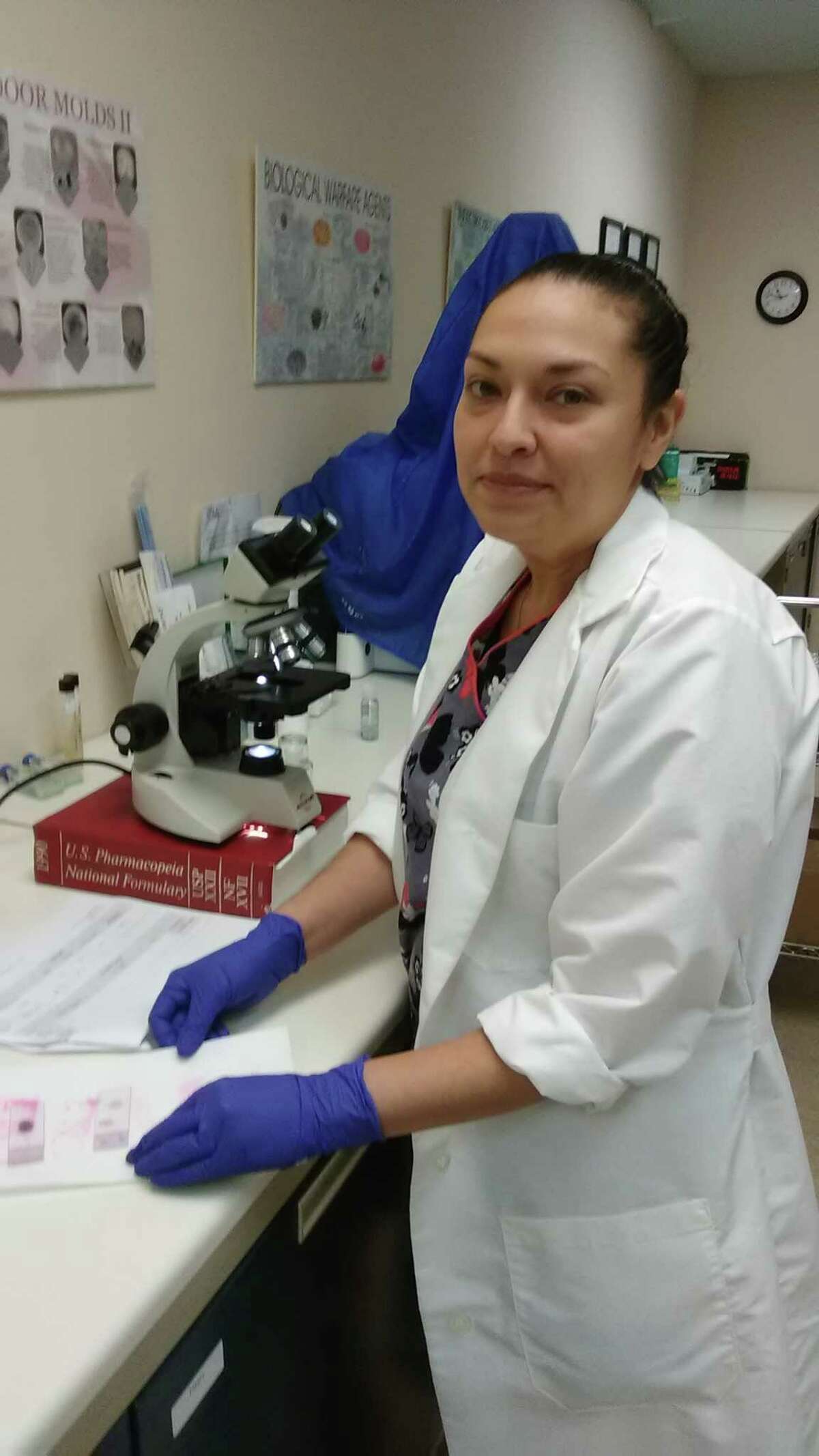 A researcher with Nova Biologicals tests food items in the lab.