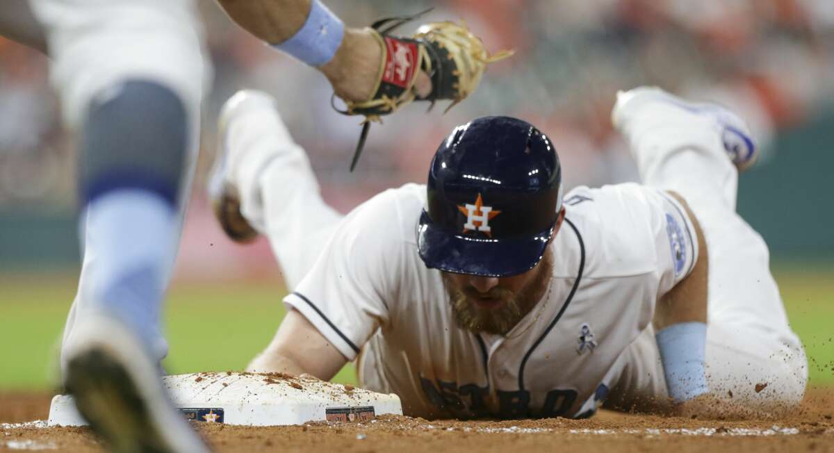 Houston Astros left fielder Derek Fisher (21) is back to the first base while Boston Red Sox relief pitcher Craig Kimbrel (46) is trying to pick him off during the bottom ninth inning of the game at Minute Maid Park Sunday, June 18, 2017, in Houston. ( Yi-Chin Lee / Houston Chronicle )