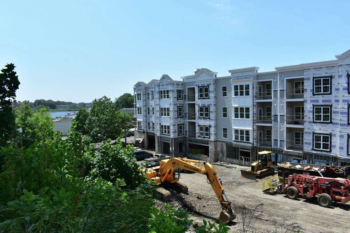Work continues on the Head of the Harbor apartment complex on Monday, June 19, 2017, in Norwalk, Conn. A Harvard University study ranked the Norwalk region in the bottom 10 of major metropolitan areas nationally for the burden of housing costs, whether for renters or owners.