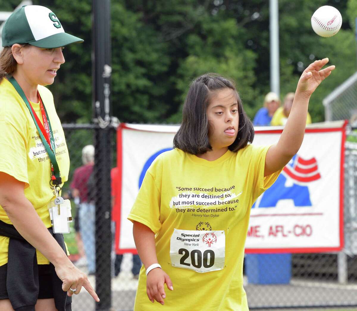 Coach Kristy LaMonda, left, helps Juliana Figueroa, 13, of East Hampton during the softball throw at the Special Olympics New York at Hudson Valley Community College Saturday June 17, 2017 in Troy, NY. (John Carl D'Annibale / Times Union)