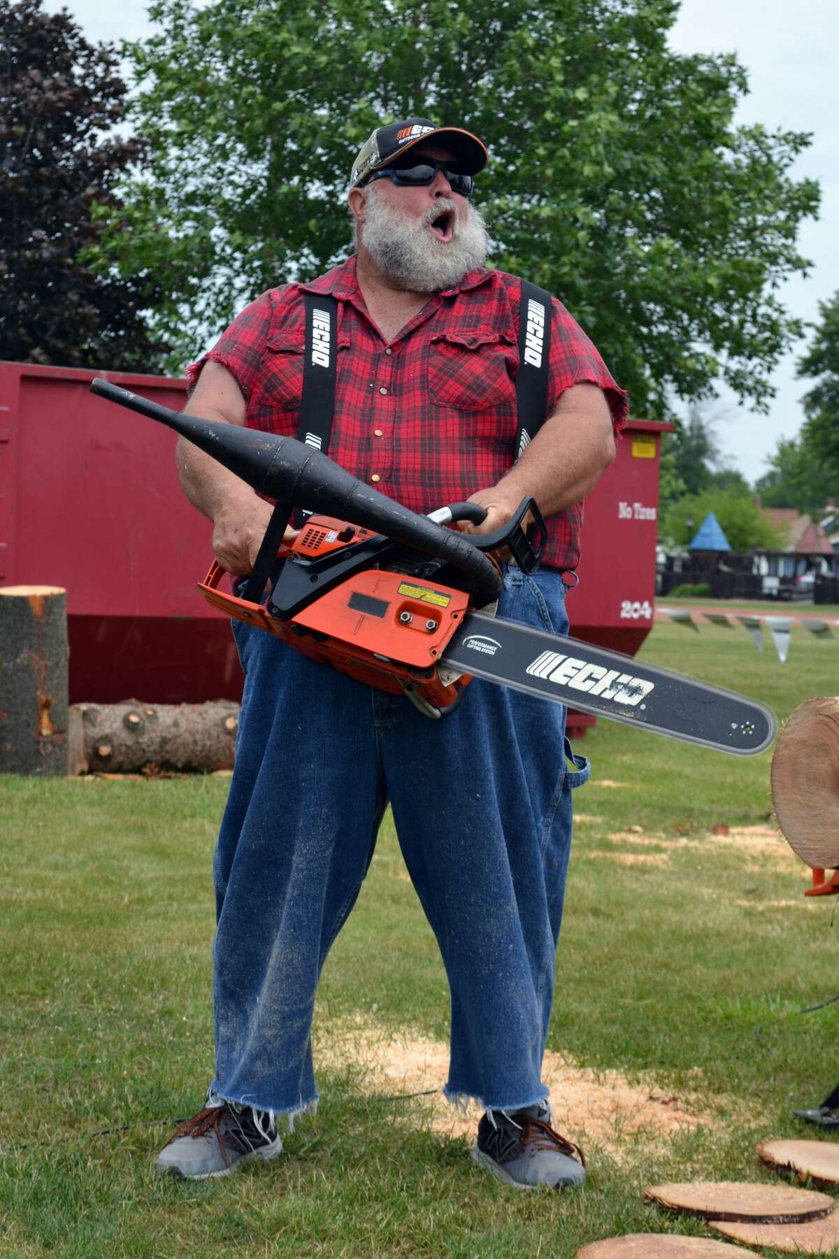    Lee LeCaptain, of The Paul Bunyon Lumberjack Show, fires up his chainsaw for a friendly log-sawing competition against two men with a hand saw – the chainsaw was victorious. The Paul Bunyon show hails all the way from St. Cloud, Florida, and the group has performed all over the U.S. and internationally. The comedic show included a hatchet throwing competition, log-splitting and woodcarving.