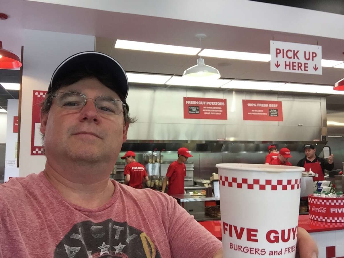 Bill Menconi of New Milford was the first customer at the new Five Guys Location at 162 Danbury Rd. in New Milford on June 19, 2017.