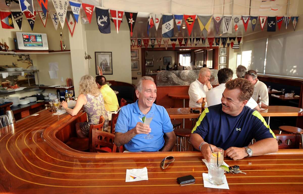 Rich Amaro, left, and Greg Di Loreto share a laugh over drinks at the Walnut Creek Yacht Club on Monday, July 6, 2009, in Walnut Creek, Calif.