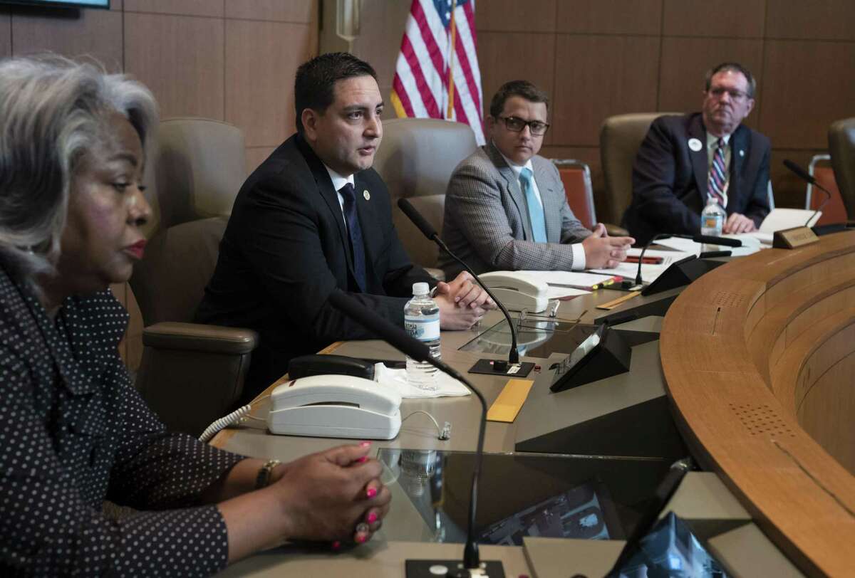 Dist. 117 Rep. Philip Cortez, second from left, questions Army attorney Jim Cannizzo (not pictured) during a hearing regarding the state's annexation law on June 19, 2017, in the San Antonio City Council Chambers.