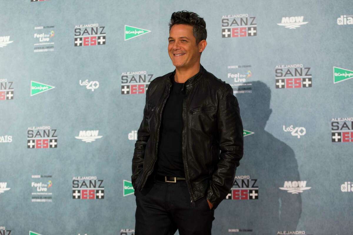 FILE - In a Wednesday, May 17, 2017 file photo, Spanish singer Alejandro Sanz poses for the media during a photo call at the Vicente Calderon stadium in Madrid. Sanz has been named 2017 Latin Recording Academy Person of the Year. The academy will honor the 18-time Latin Grammy Award winner and three-time Grammy Award winner on Nov. 15 at the Mandalay Bay Convention Center in Las Vegas, on the eve of the Latin Grammys. (AP Photo/Francisco Seco, File)