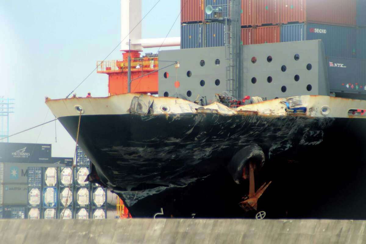 The container ship ACX Crystal with its left bow dented and scraped after colliding with the USS Fitzgerald in the waters off the Izu Peninsula on Saturday, June 17, 2017, is berthed at the Yokohama port near Tokyo, Monday, June 19, 2017. The ships collided about early Saturday, when the Navy said most of the 300 sailors on board would have been sleeping, and authorities have declined to speculate on a cause while the crash remains under investigation.(Hiroshi Kashimura/Kyodo News via AP)