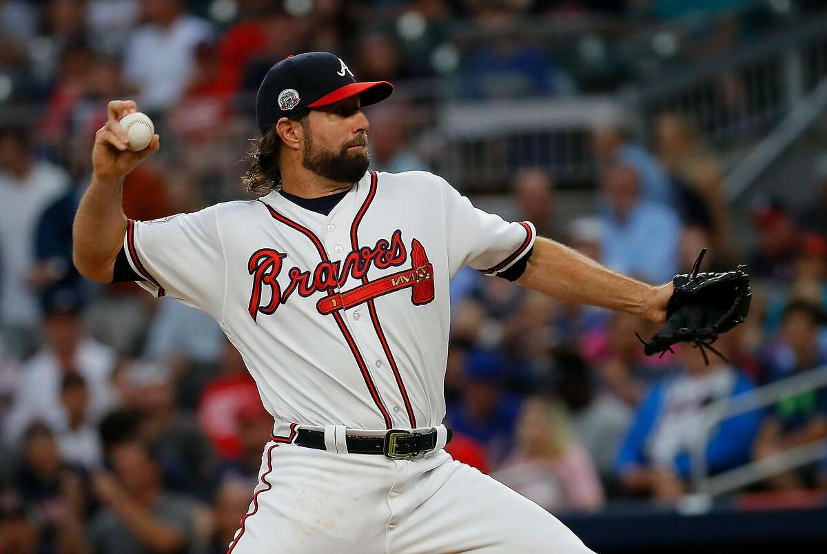 ATLANTA, GA - JUNE 19: R.A. Dickey #19 of the Atlanta Braves pitches in the first inning against the San Francisco Giants at SunTrust Park on June 19, 2017 in Atlanta, Georgia. (Photo by Kevin C. Cox/Getty Images)