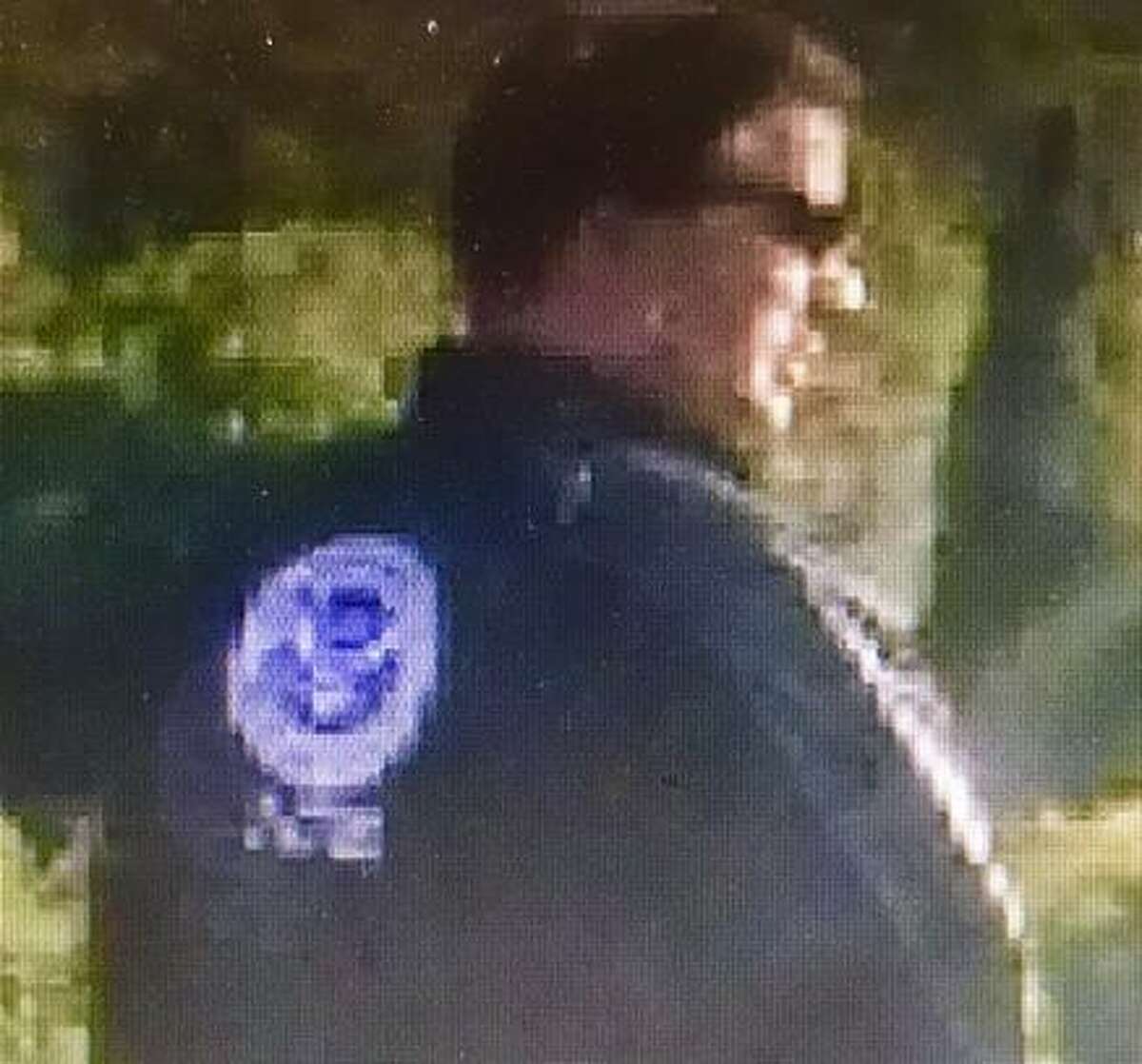 A man said to be Peter Acton is seen wearing an ICE jacket outside a San Rafael church.