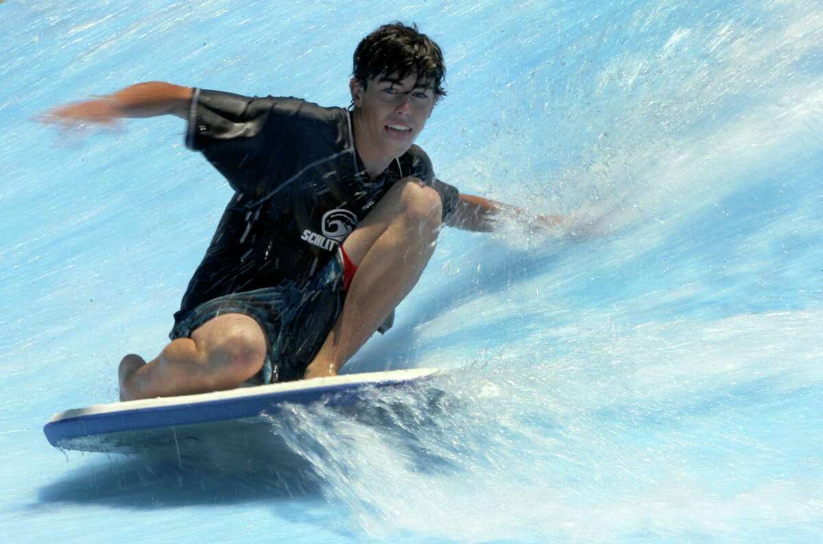A competitor in the Boogie Bahn Classic Surf Competition has a smooth wide on the waves at the Schlitterbahn Waterpark in New Braunfels.