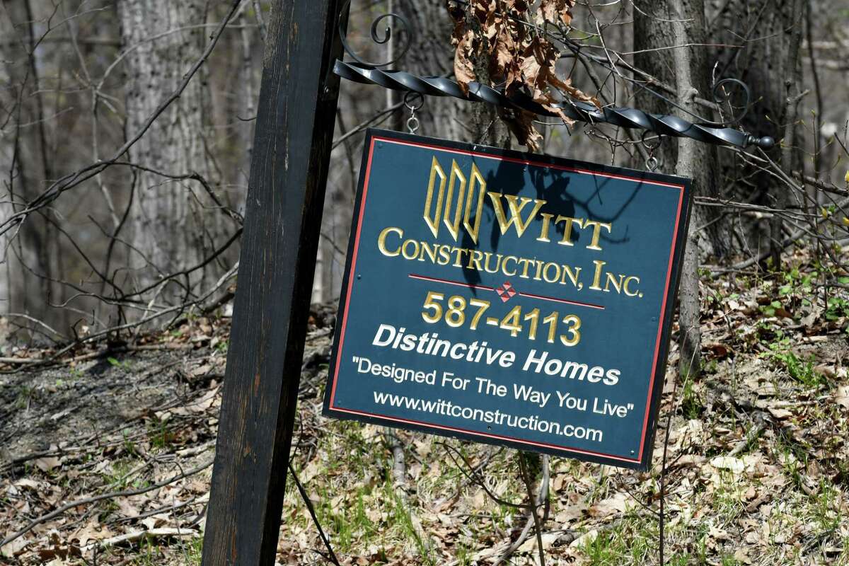 A Witt Construction sign is posted at the end of Hill Road where a development is proposed in Saratoga, N.Y. 