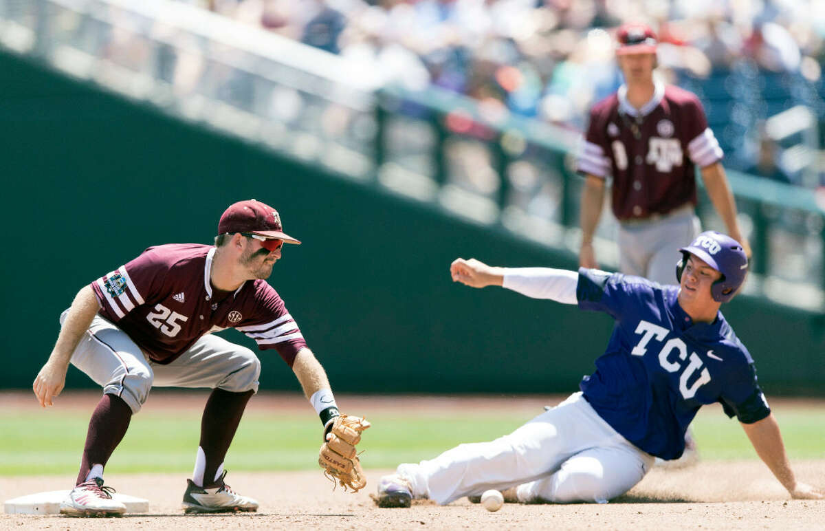 9 of 900 CWS Texas AM TCU Baseball TCU's Josh Watson steals second beating the throw from Texas A&M catcher Cole Bedford and the tag by shortstop Austin Homan in the fourth inning of an NCAA College World Series baseball elimination game in Omaha, Neb., Tuesday, June 20, 2017. (Matt Dixon/Omaha World-Herald via AP)