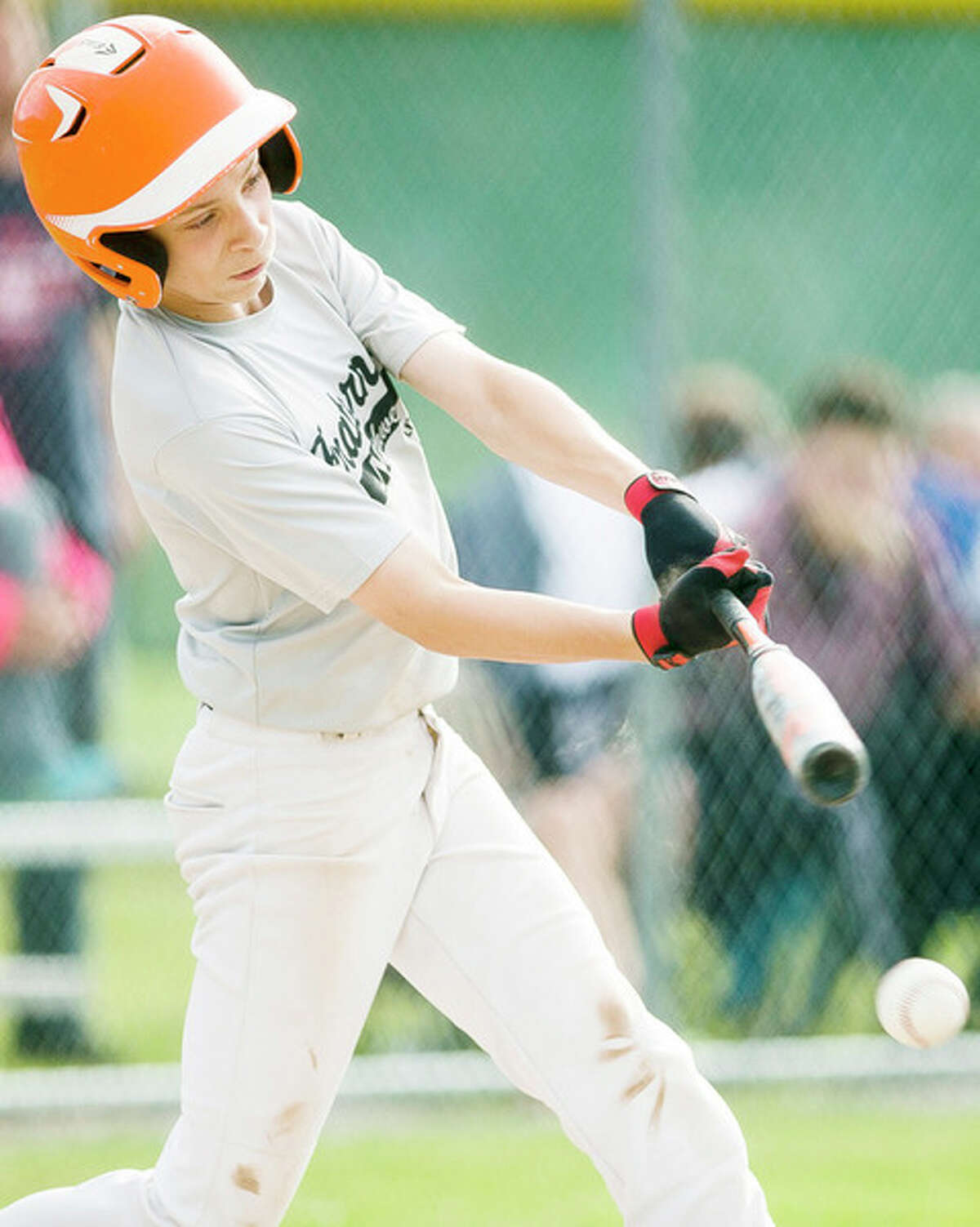 KATY KILDEE | kkildee@mdn.net Anthony Colmus takes a swing during his team's 12-2 victory over Sowle Properties during the major Little League city championship game on Tuesday in Midland.