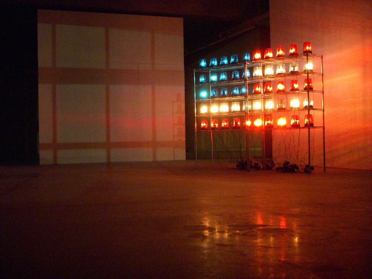 Blake Fall Conroy's "Police Flag" (2009), composed of rotating beacons, extension cords, tupperware and other found objects,�is a work in the Museum of Capitalism.