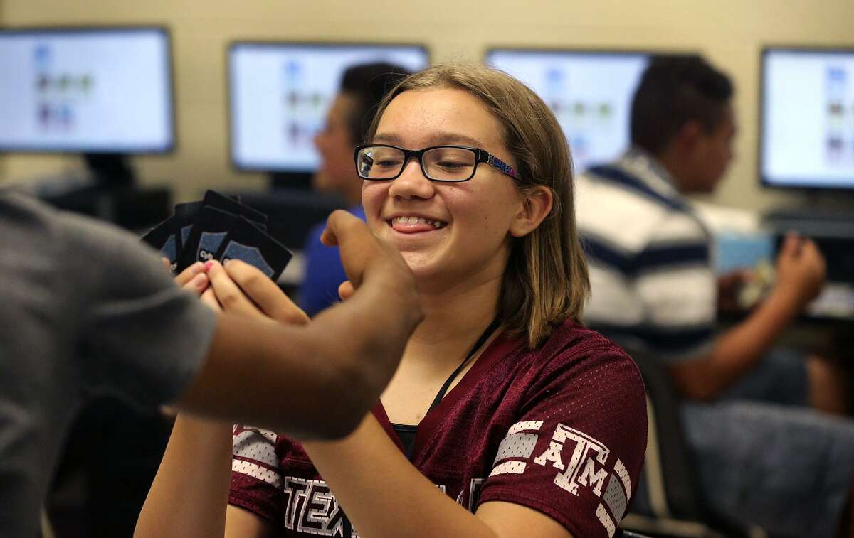 Ronald McNair Middle School student Kassidee Webb,12, enjoys Thursday October 20, 2016 a card game called Cyber Threat Defender that was developed by a professor at the University of Texas at San Antonio to teach young students about cyber security. Teacher Michael Maldonado says the game teaches students "how to build a network and defend a network." McNair Middle School is in the Southwest Independent School District.