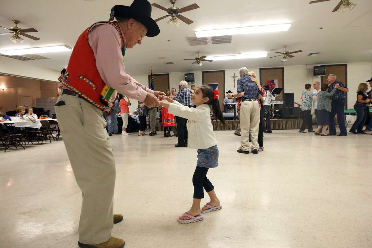 Ledislav Zezula, 79, dances with 4-year-old Grace Castro during the Bexar County Chapter of The Czech Heritage Society of Texas annual Czech Heritage Festival at Knights of Columbus on Rigsby Avenue, Oct. 21, 2012. Music by Chris Rybak, food, costumes, genealogy displays and a silent auction were part of the festival.