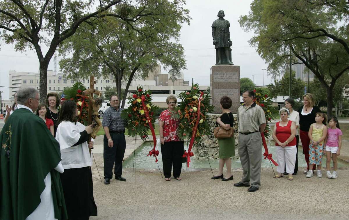 Father Ed Kelly (left) oversees a 2008 ceremony as the San Antonio Christopher Columbus Italian Society commemorates the 15th century explorer’s 1492 voyage to the New World. Archaeologists now believe the area was the first site of the Mission San Antonio de Valero in 1718.