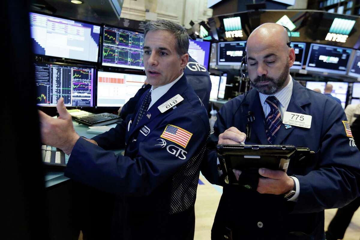 Specialist Anthony Rinaldi, left, and trader Fred Demarco work on the floor of the New York Stock Exchange, Wednesday, June 21, 2017. Stocks are opening slightly higher on Wall Street, led by gains in health care and technology companies. (AP Photo/Richard Drew)