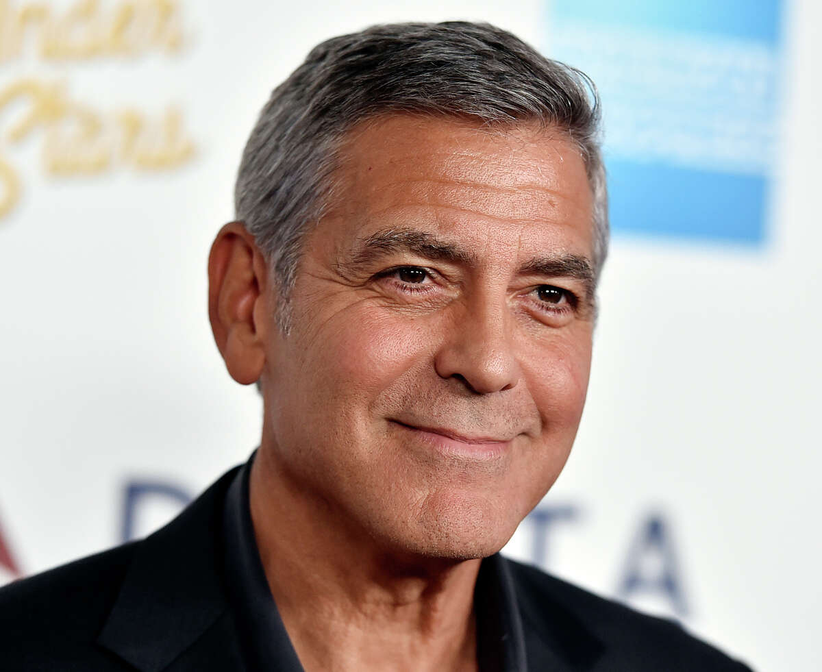 FILE - In this Saturday, Oct. 1, 2016, file photo, George Clooney arrives at MPTF's 95th Anniversary Celebration "Hollywood's Night Under The Stars" in Los Angeles. Global liquor behemoth Diageo says it will pay up to $1 billion to buy a tequila brand co-founded by movie star George Clooney. Clooney founded the Casamigos brand with partners Rande Gerber and Mike Meldma. Diageo says it will pay $700 million for Casamigos at first, and then pay another $300 million over 10 years if the brand reaches certain performance milestones. (Photo by Jordan Strauss/Invision/AP, File)