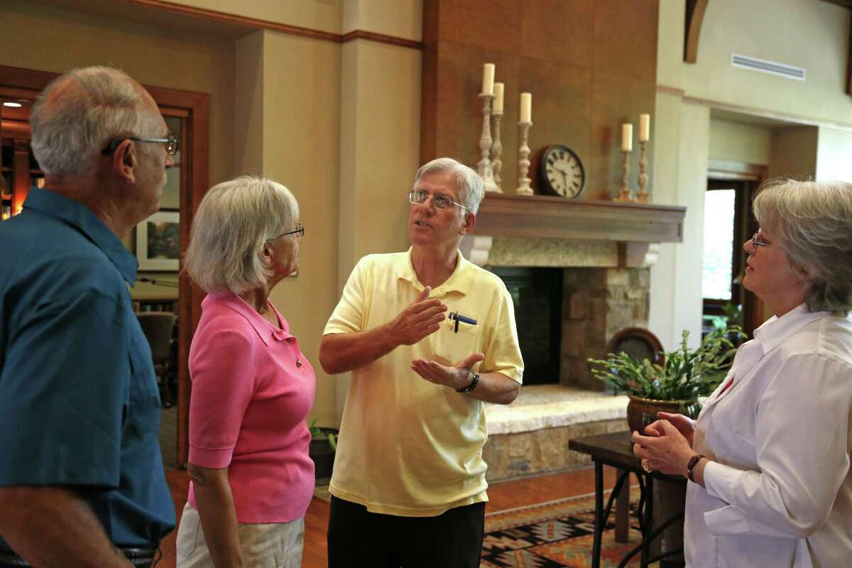 Clay Hadick, center, talks with Rick and Shirley Hill, left, as his wife, Dianna Hadick, right, listens. The Hadicks moved to Bexar County in 2012 from Princeton, New Jersey. They live in Alamo Ranch in a gated community for people 55 years old and older.