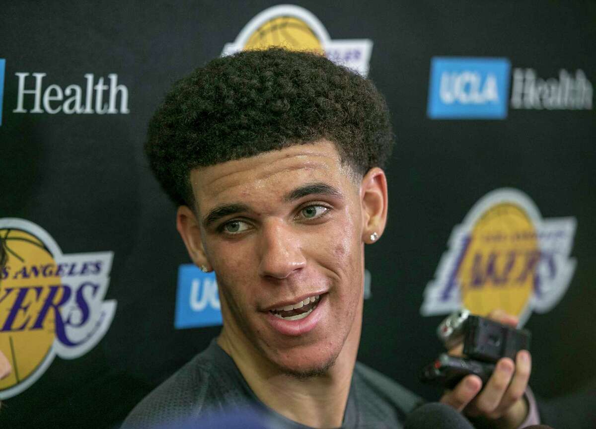 FILE - In this June 7, 2017, file photo, University of California Los Angeles guard Lonzo Ball takes questions from the media after a closed Los Angeles Lakes pre-draft workout in El Segundo, Calif. By now the entire basketball world knows Lonzo Ball is a singular talent with a unique parent. (AP Photo/Damian Dovarganes, File)
