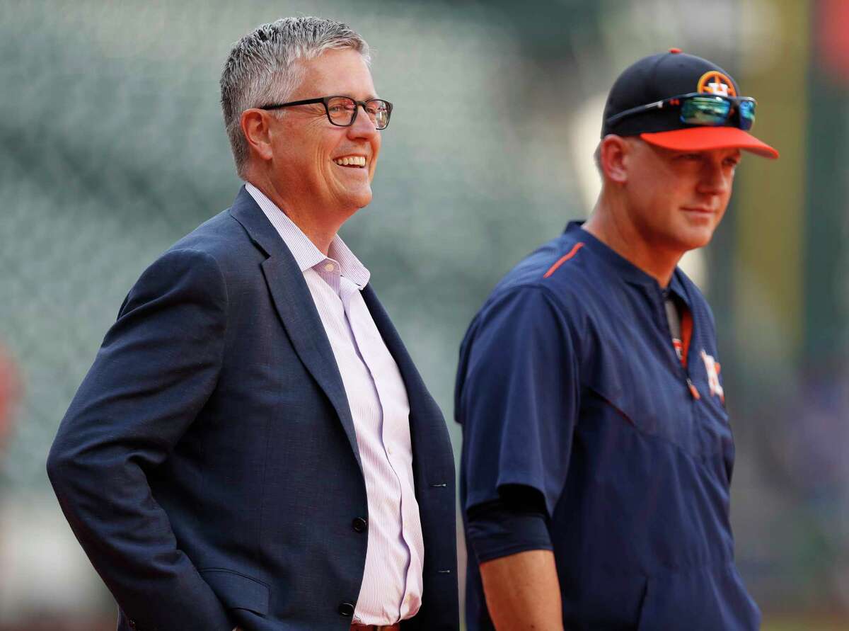 The Astros' 13-game lead in the AL West affords general manager Jeff Luhnow, left, and skipper A.J. Hinch much patience in roster upgrades.