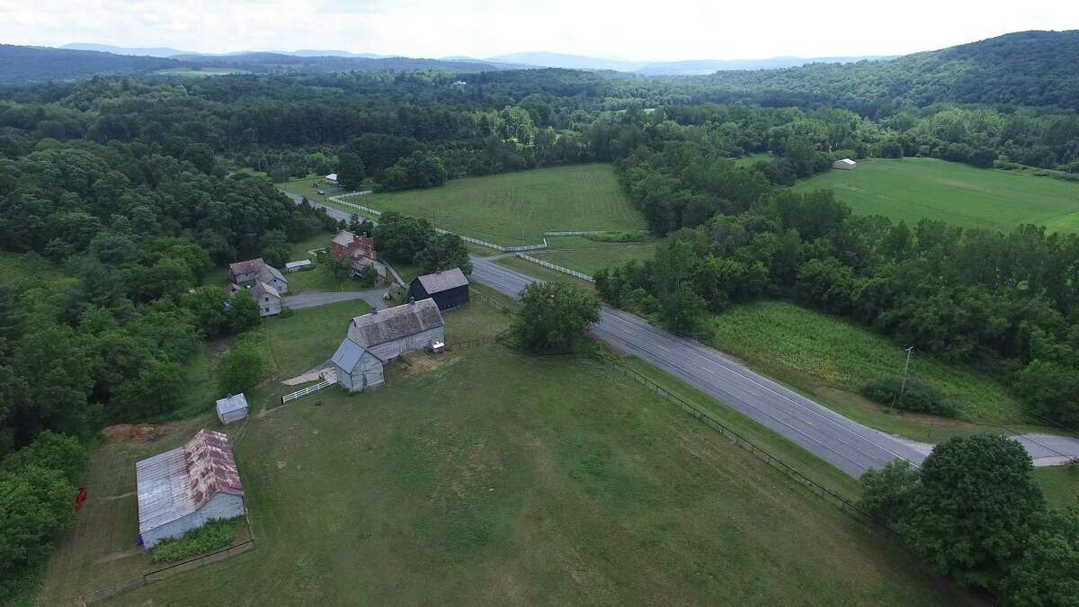 The equestrian estate at 22420 State Route 22, Eagle Bridge is 110 acres. There is a barn on the property already suitable for 5 to 9 horses, paddocks, and room for a indoor arena. List price: $1.3 million.