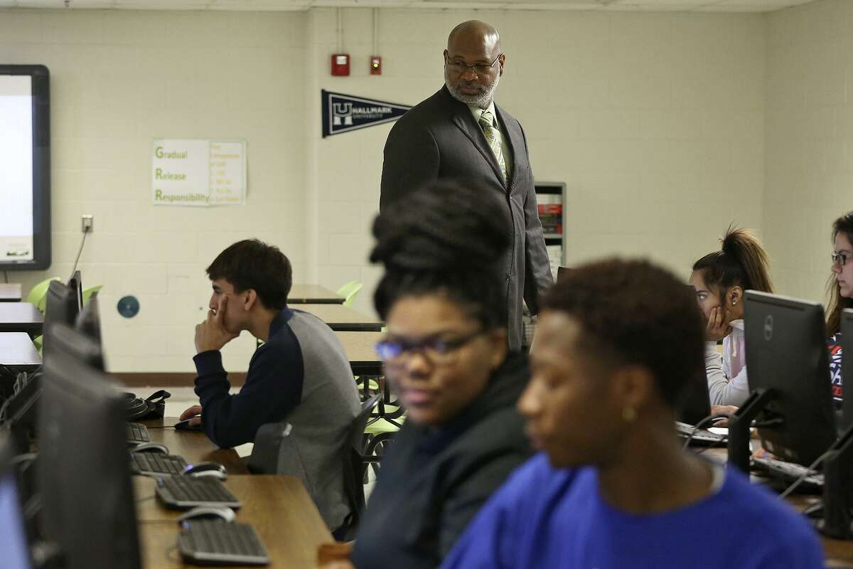 Sam Houston High School Principal Darnell White walks around a STEAM class in the New Tech program at the school on November 30, 2016.