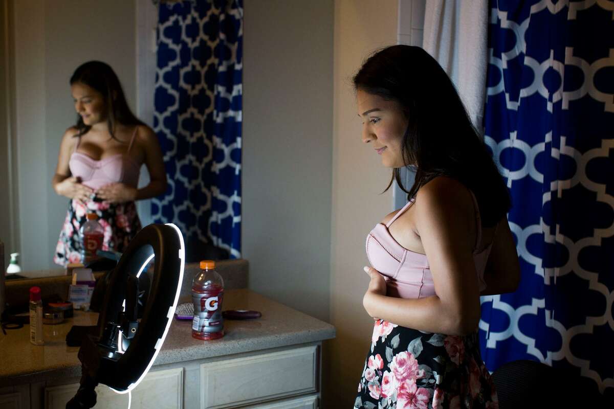 Catizia Farris does a makeup tutorial for the "Beauty Escape" group on Facebook Live at her boyfriend's apartment in San Antonio, Texas on June 3, 2017. During the video, which got over 2,700 views, Catizia would not only explain what types of products she uses and how, but also answered questions about being trans. After doing these videos, she said that sometimes she receives messages from people seeking help who think they might be trans. "My mom would spoil me buying makeup and I would just put it on and take it off over and over again," she said of Lauryn Farris when Catizia first came out.