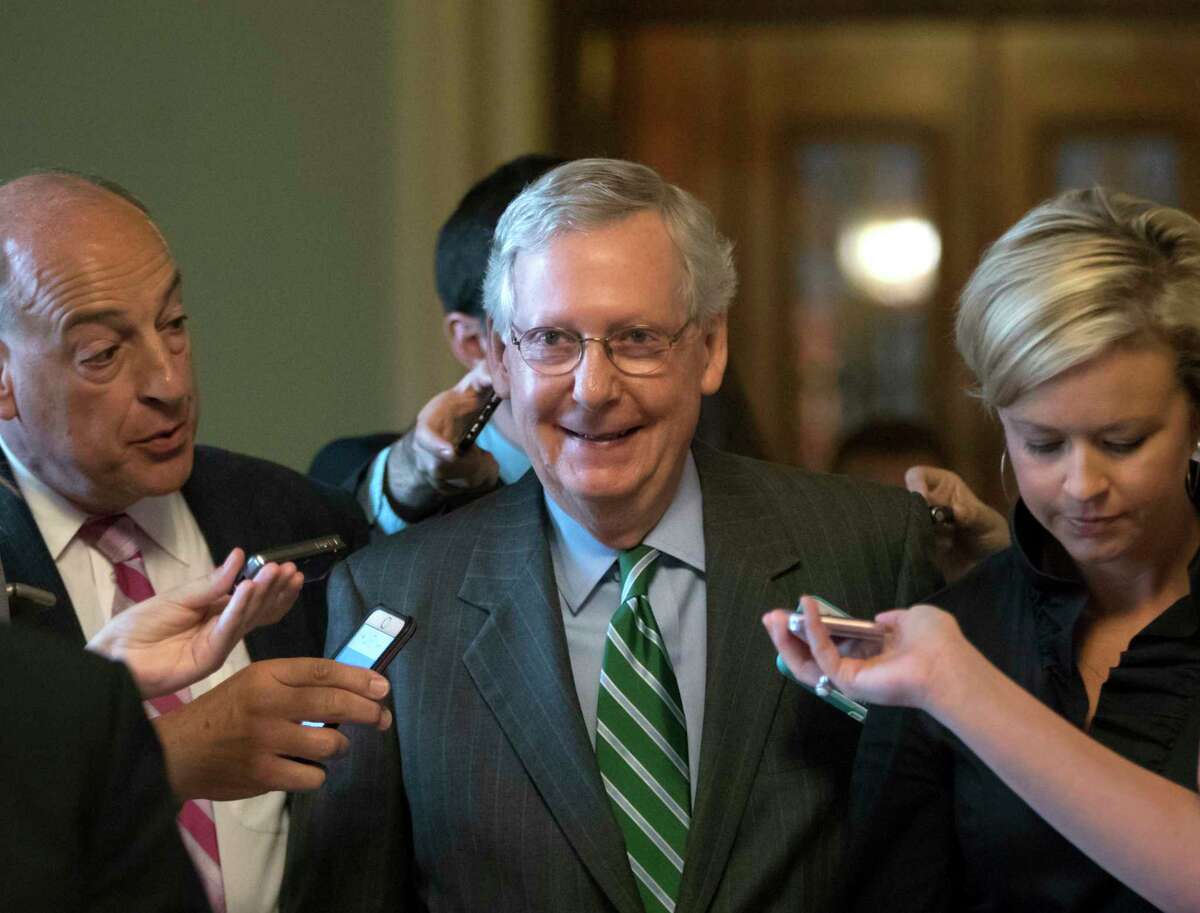 Senate Majority leader Mitch McConnell smiles Thursday after announcing the release of the Republicans' health care bill which represents the GOP's long-awaited attempt to scuttle much of President Barack Obama's Affordable Care Act. (AP Photo / J. Scott Applewhite)