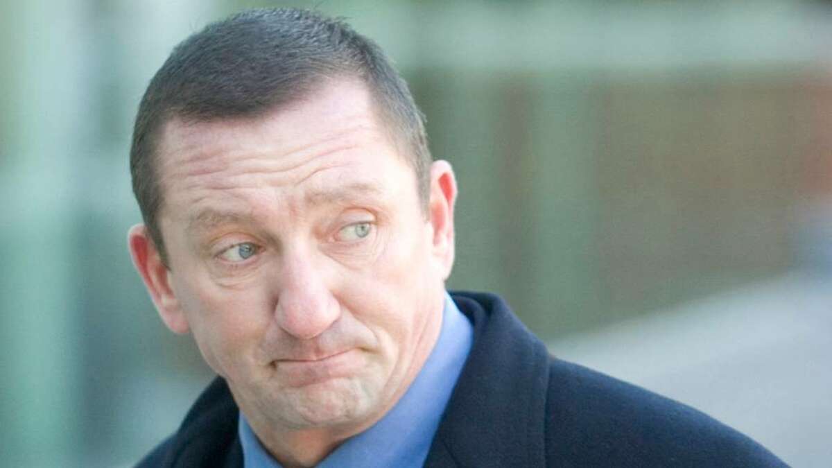 Former Norwalk police lieutenant Thomas Cummings arrives at Superior Court in Stamford, on Thursday, Feb. 14, 2008. Cummings took a plea deal on the eve of his trial Wednesday.